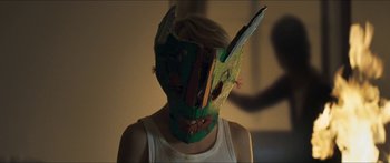 Movie still from “Goodnight Mommy” (2014), directed by Severin Fiala – A person wearing a paper mache mask; Close Up shot, Over the shoulder angle