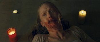 Movie still from “Goodnight Mommy” (2014), directed by Severin Fiala – A person with blood on their face; Close Up shot, Overhead angle