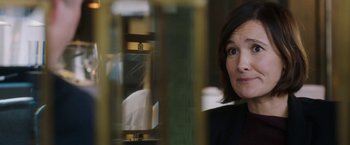 Movie still from “Greed” (2019), directed by Michael Winterbottom – A person looking at the camera; Close Up shot, Over the shoulder angle