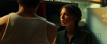 Movie still from “Green Lantern” (2011), directed by Martin Campbell – A woman looking at her reflection in a mirror; Close Up shot, Over the shoulder angle