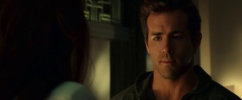 Movie still from “Green Lantern” (2011), directed by Martin Campbell – A person looking at the camera; Close Up shot, Over the shoulder angle