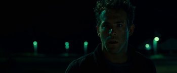 Movie still from “Green Lantern” (2011), directed by Martin Campbell – A person wearing a black shirt; Close Up shot, Low angle