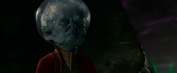Movie still from “Green Lantern” (2011), directed by Martin Campbell – An image of an alien character in a dark setting; Close Up shot, Low angle