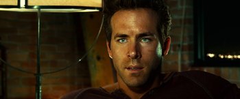 Movie still from “Green Lantern” (2011), directed by Martin Campbell – A person with blue eyes; Close Up shot, Over the shoulder angle