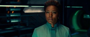 Movie still from “Green Lantern” (2011), directed by Martin Campbell – A person wearing a suit; Close Up shot, Over the shoulder angle