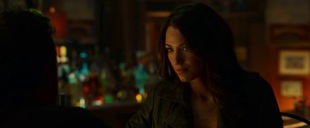 Movie still from “Green Lantern” (2011), directed by Martin Campbell – A beautiful woman with long hair wearing a leather jacket; Close Up shot, Over the shoulder angle