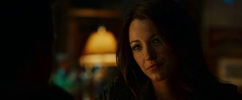 Movie still from “Green Lantern” (2011), directed by Martin Campbell – A woman's face in a dark room; Close Up shot, Over the shoulder angle