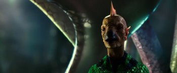 Movie still from “Green Lantern” (2011), directed by Martin Campbell – A person with a strange mask on their face; Close Up shot, Low angle