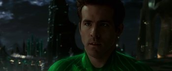 Movie still from “Green Lantern” (2011), directed by Martin Campbell – A person wearing a green shirt; Close Up shot, Over the shoulder angle