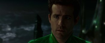 Movie still from “Green Lantern” (2011), directed by Martin Campbell – A person wearing a green shirt; Close Up shot, Over the shoulder angle