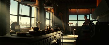 Movie still from “Green Lantern” (2011), directed by Martin Campbell – A room with a table and a chair in it; Wide shot, Low angle