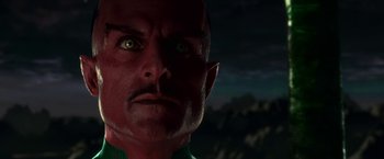 Movie still from “Green Lantern” (2011), directed by Martin Campbell – A man's face with a mountain in the background; Close Up shot, High angle