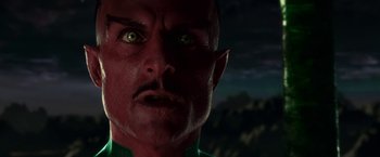 Movie still from “Green Lantern” (2011), directed by Martin Campbell – A man's face with green eyes; Close Up shot, Low angle