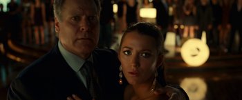 Movie still from “Green Lantern” (2011), directed by Martin Campbell – A man and a woman posing for a picture; Close Up shot, Low angle