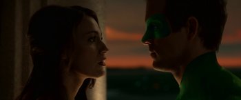 Movie still from “Green Lantern” (2011), directed by Martin Campbell – A man and a woman face to face in front of a sunset; Close Up shot, Over the shoulder angle