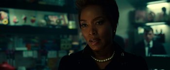 Movie still from “Green Lantern” (2011), directed by Martin Campbell – A person wearing a necklace; Close Up shot, Over the shoulder angle