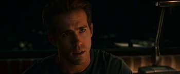 Movie still from “Green Lantern” (2011), directed by Martin Campbell – A person wearing a shirt; Close Up shot, Over the shoulder angle