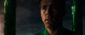 Movie still from “Green Lantern” (2011), directed by Martin Campbell – A person wearing a green shirt; Close Up shot, Low angle