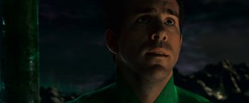 Movie still from “Green Lantern” (2011), directed by Martin Campbell – A person wearing a green shirt; Close Up shot, Low angle
