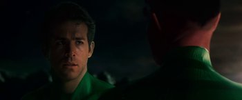 Movie still from “Green Lantern” (2011), directed by Martin Campbell – A person wearing a green shirt; Close Up shot, Over the shoulder angle