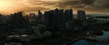 Movie still from “Green Lantern” (2011), directed by Martin Campbell – A view of a city skyline at sunset; Extreme Wide shot, High angle