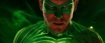 Movie still from “Green Lantern” (2011), directed by Martin Campbell – A person wearing a green costume; Close Up shot, Low angle