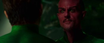 Movie still from “Green Lantern” (2011), directed by Martin Campbell – A person with green eyes; Close Up shot, Over the shoulder angle