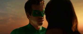 Movie still from “Green Lantern” (2011), directed by Martin Campbell – A person wearing a green mask; Close Up shot, Over the shoulder angle