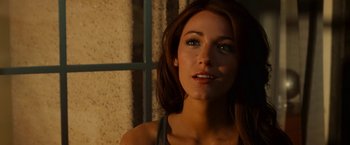 Movie still from “Green Lantern” (2011), directed by Martin Campbell – A beautiful woman standing in front of a window; Close Up shot, High angle