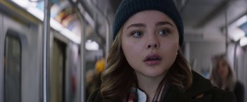 Movie still from “Greta” (2018), directed by Neil Jordan – A person on a train; Close Up shot, Low angle