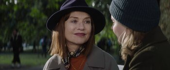 Movie still from “Greta” (2018), directed by Neil Jordan – A person wearing a hat; Close Up shot, Over the shoulder angle