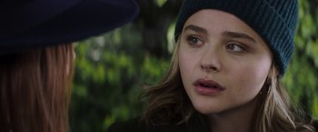 Movie still from “Greta” (2018), directed by Neil Jordan – A person wearing a hat; Close Up shot, Over the shoulder angle