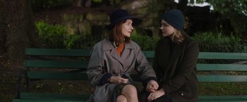 Movie still from “Greta” (2018), directed by Neil Jordan – Two women sitting on a bench in a park; Medium shot, Over the shoulder angle