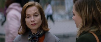 Movie still from “Greta” (2018), directed by Neil Jordan – A person wearing a jacket; Close Up shot, Over the shoulder angle