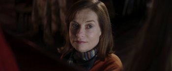 Movie still from “Greta” (2018), directed by Neil Jordan – A person wearing a sweater; Close Up shot, Over the shoulder angle