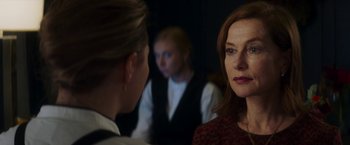 Movie still from “Greta” (2018), directed by Neil Jordan – Two women are talking to each other in a dark room; Close Up shot, Over the shoulder angle