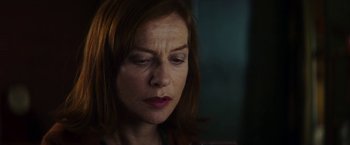 Movie still from “Greta” (2018), directed by Neil Jordan – A person with red hair looking down; Close Up shot, Low angle