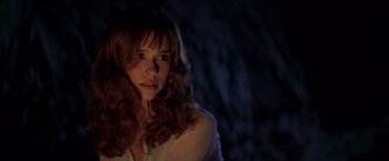 Movie still from “I Know What You Did Last Summer” (1997), directed by Jim Gillespie – A woman with long red curly hair stares into the camera; Close Up shot, Low angle