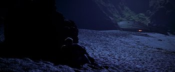 Movie still from “I Know What You Did Last Summer” (1997), directed by Jim Gillespie – A person laying on the ground in the dark; Extreme Wide shot, High angle