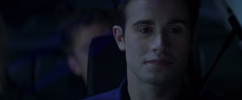 Movie still from “I Know What You Did Last Summer” (1997), directed by Jim Gillespie – A man's face in a dark room; Close Up shot, Over the shoulder angle