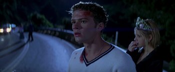 Movie still from “I Know What You Did Last Summer” (1997), directed by Jim Gillespie – A young man with blood all over his face; Close Up shot, Low angle