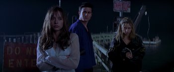 Movie still from “I Know What You Did Last Summer” (1997), directed by Jim Gillespie – A group of people standing next to each other on a bridge; Medium shot, Low angle