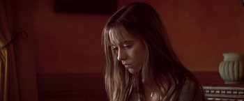 Movie still from “I Know What You Did Last Summer” (1997), directed by Jim Gillespie – A woman with long hair is looking down; Close Up shot, Low angle