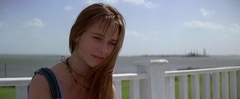 Movie still from “I Know What You Did Last Summer” (1997), directed by Jim Gillespie – A young woman with long hair wearing a necklace; Close Up shot, Low angle