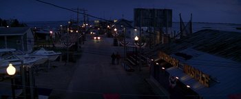Movie still from “I Know What You Did Last Summer” (1997), directed by Jim Gillespie – Two people are walking down a street at night; Extreme Wide shot, High angle