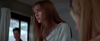 Movie still from “I Know What You Did Last Summer” (1997), directed by Jim Gillespie – A woman with long red hair is looking to her left; Close Up shot, Low angle