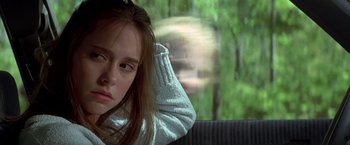 Movie still from “I Know What You Did Last Summer” (1997), directed by Jim Gillespie – A young girl sitting in a car looking out the window; Close Up shot, Over the shoulder angle