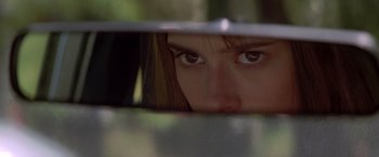 Movie still from “I Know What You Did Last Summer” (1997), directed by Jim Gillespie – A person's eyes in a car mirror; Close Up shot, Over the shoulder angle