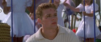 Movie still from “I Know What You Did Last Summer” (1997), directed by Jim Gillespie – A young man with an injury on his forehead; Close Up shot, Low angle