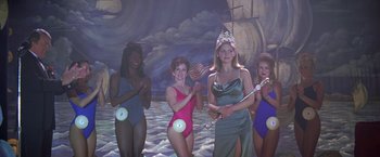 Movie still from “I Know What You Did Last Summer” (1997), directed by Jim Gillespie – A group of women standing next to each other in swimsuits; Medium shot, Low angle
